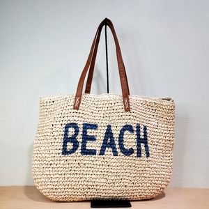 Beach Bag Synthetic Straw with the word "Beach" on it
